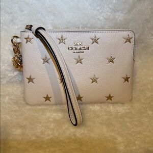 Coach Leather Cream Wristlet with Gold Star Accents and charms NEW